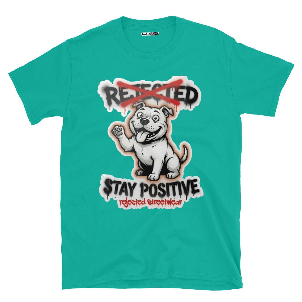 Stay Positive pit bull tee — white bully pup sitting with one paw raised, REJECTED crossed out in red