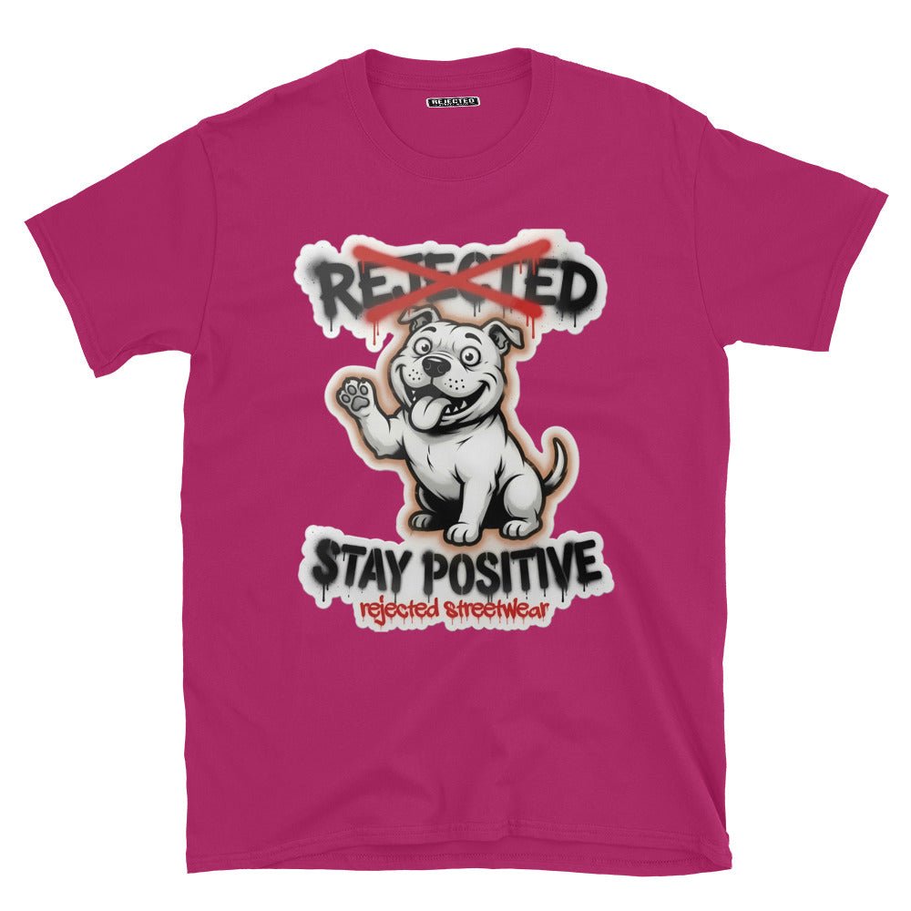 Stay Positive pit bull tee — white bully pup sitting with one paw raised, REJECTED crossed out in red