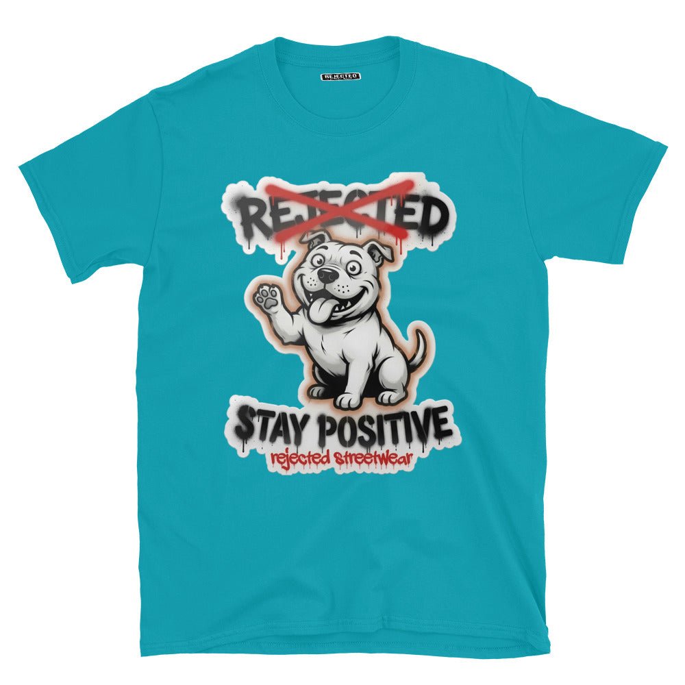 Stay Positive pit bull tee — white bully pup sitting with one paw raised, REJECTED crossed out in red