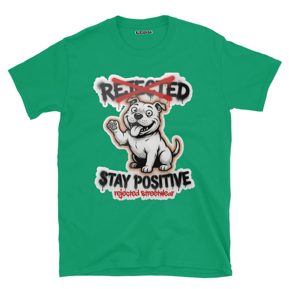 Stay Positive pit bull tee — white bully pup sitting with one paw raised, REJECTED crossed out in red