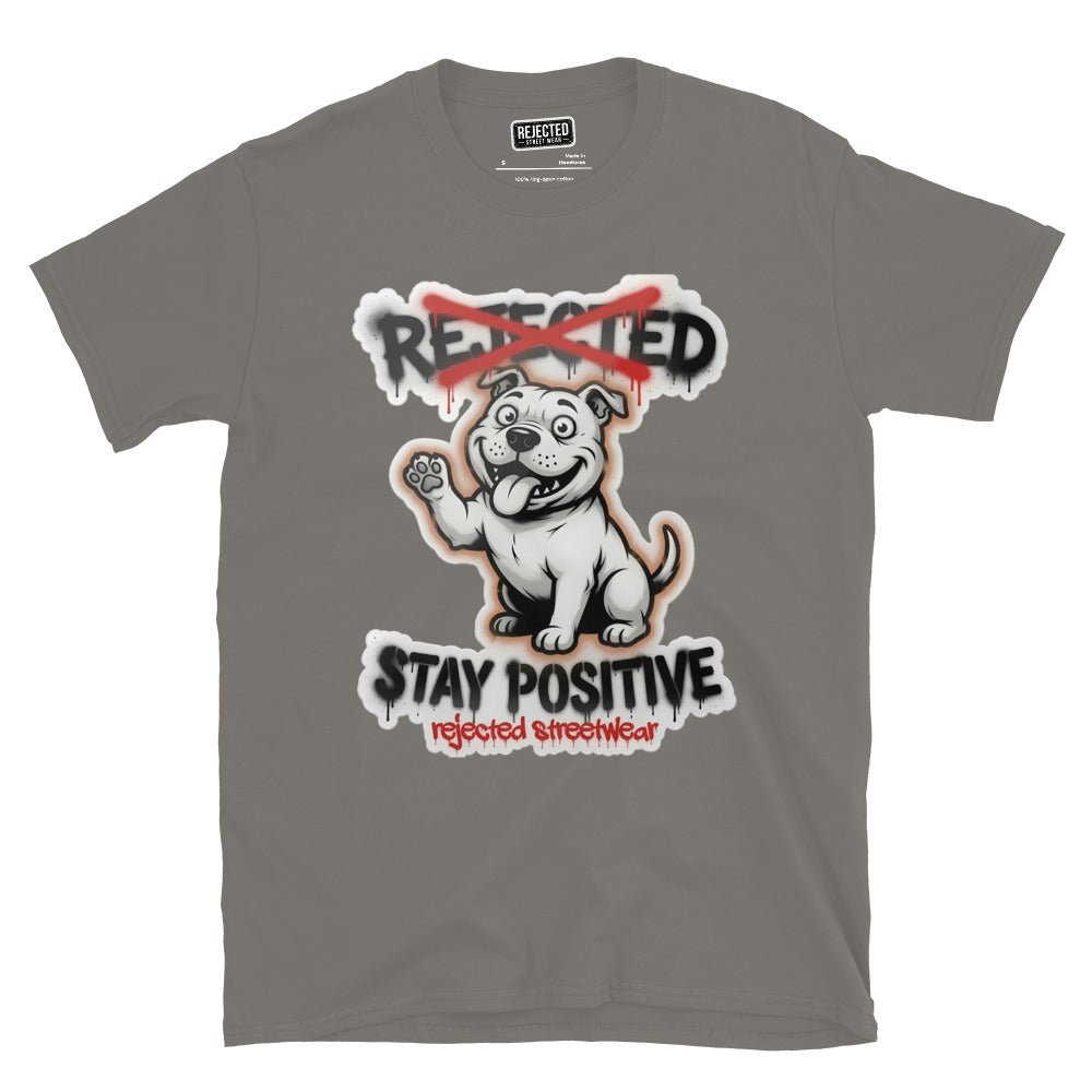 Stay Positive pit bull tee — white bully pup sitting with one paw raised, REJECTED crossed out in red