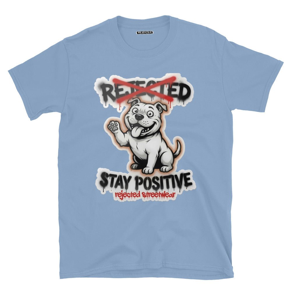 Stay Positive pit bull tee — white bully pup sitting with one paw raised, REJECTED crossed out in red