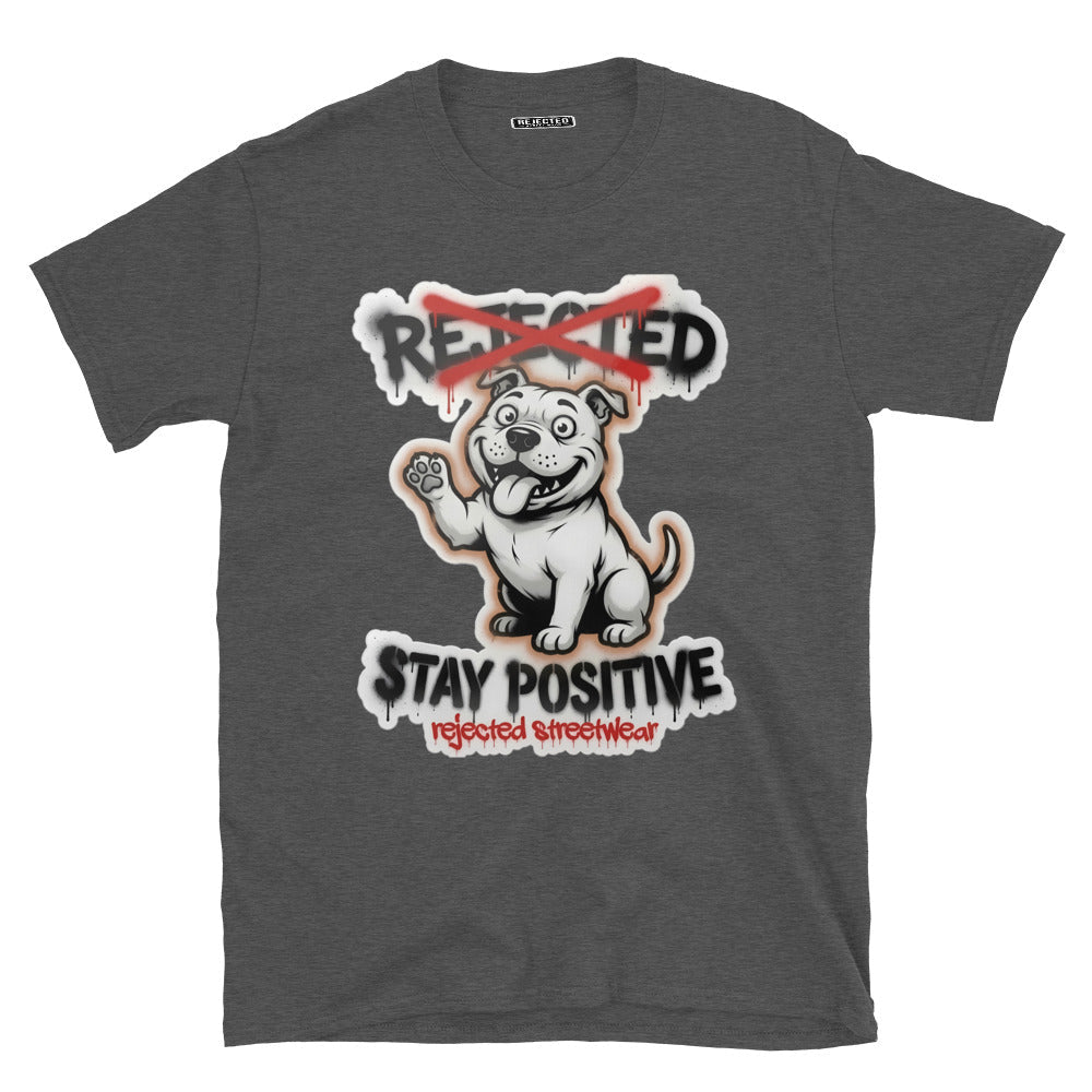 Stay Positive pit bull tee — white bully pup sitting with one paw raised, REJECTED crossed out in red