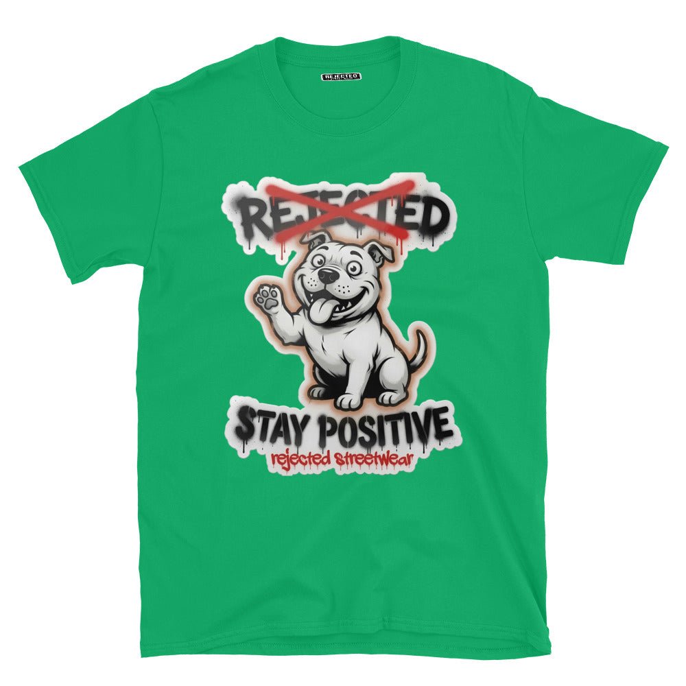 Stay Positive pit bull tee — white bully pup sitting with one paw raised, REJECTED crossed out in red