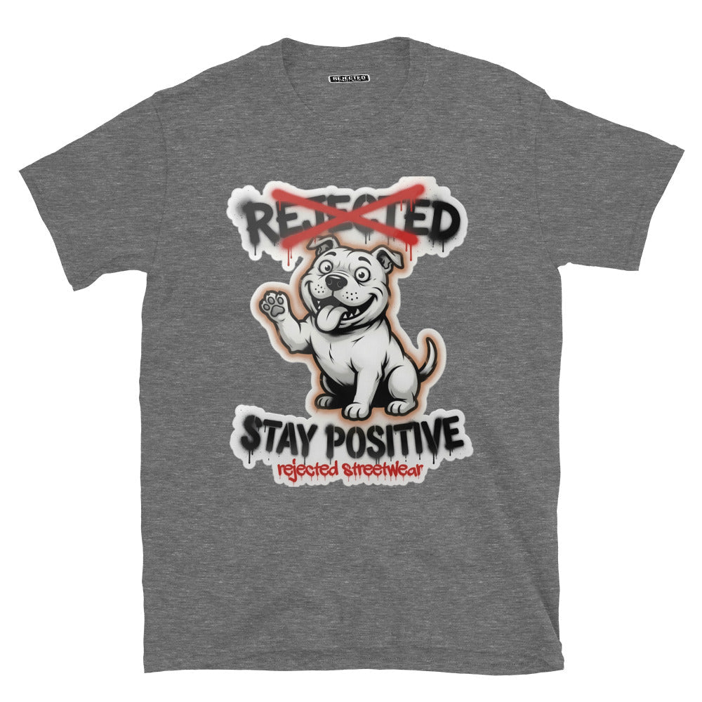 Stay Positive pit bull tee — white bully pup sitting with one paw raised, REJECTED crossed out in red