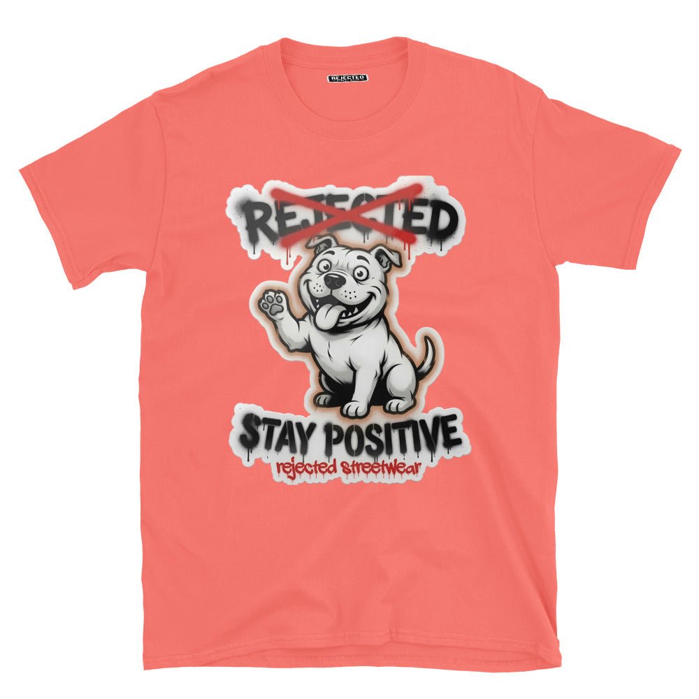 Stay Positive pit bull tee — white bully pup sitting with one paw raised, REJECTED crossed out in red