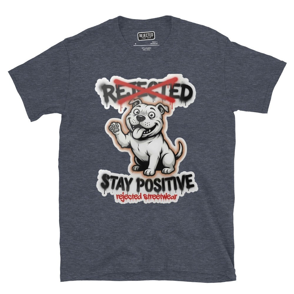 Stay Positive pit bull tee — white bully pup sitting with one paw raised, REJECTED crossed out in red