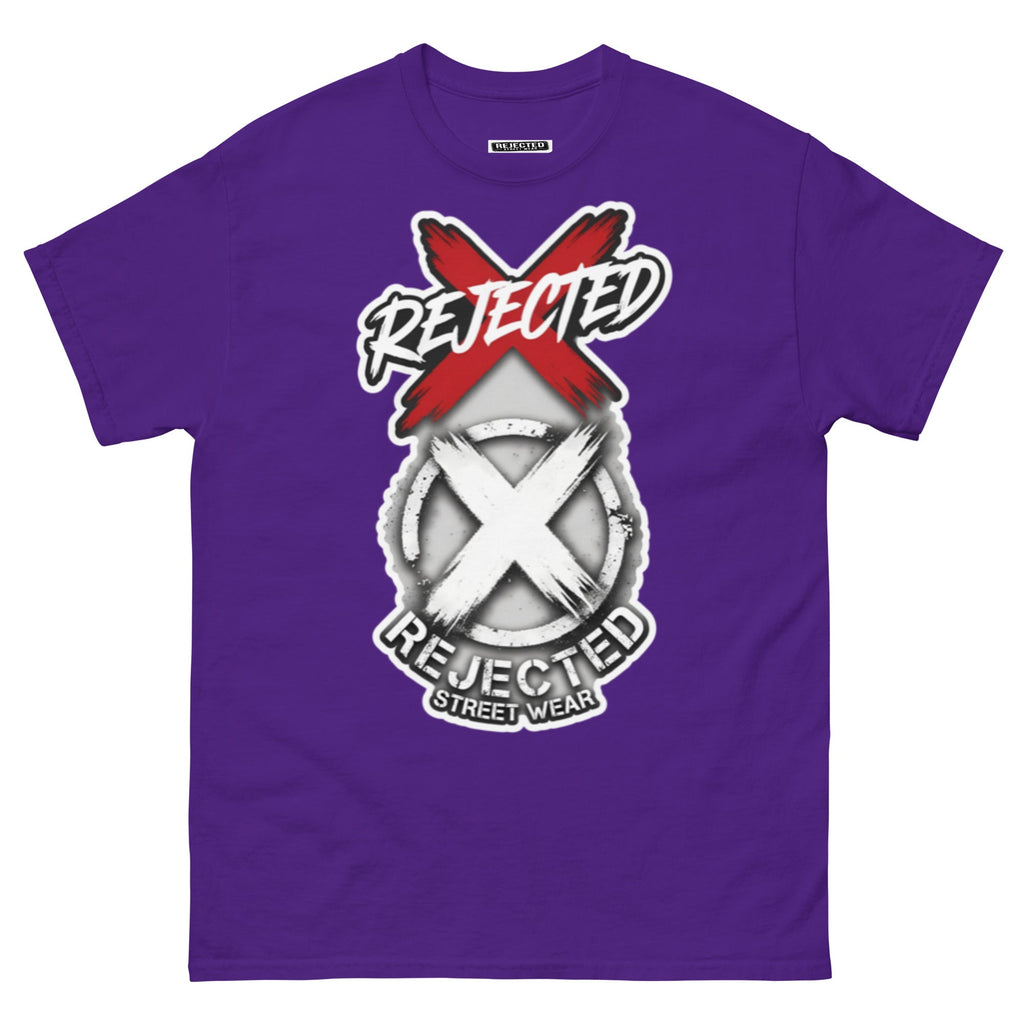 Reject Labels Be Human tee — REJECTED crossed out in red above the X emblem with the word Human underneath
