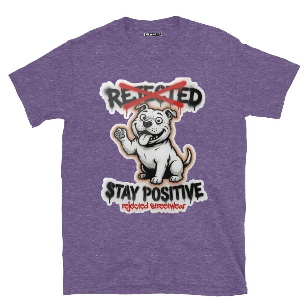 Stay Positive pit bull tee — white bully pup sitting with one paw raised, REJECTED crossed out in red