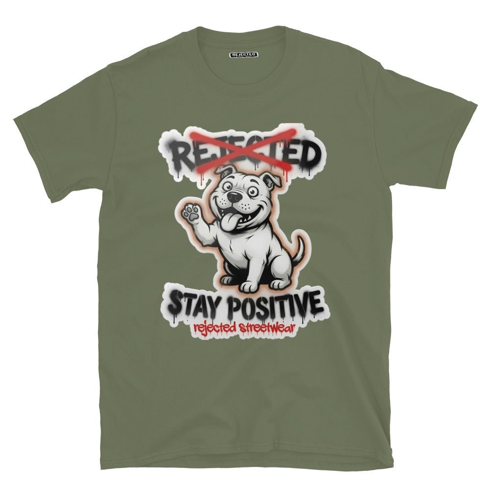Stay Positive pit bull tee — white bully pup sitting with one paw raised, REJECTED crossed out in red
