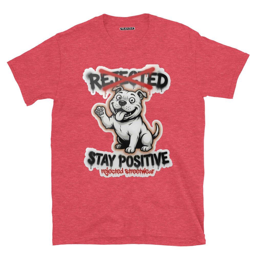 Stay Positive pit bull tee — white bully pup sitting with one paw raised, REJECTED crossed out in red