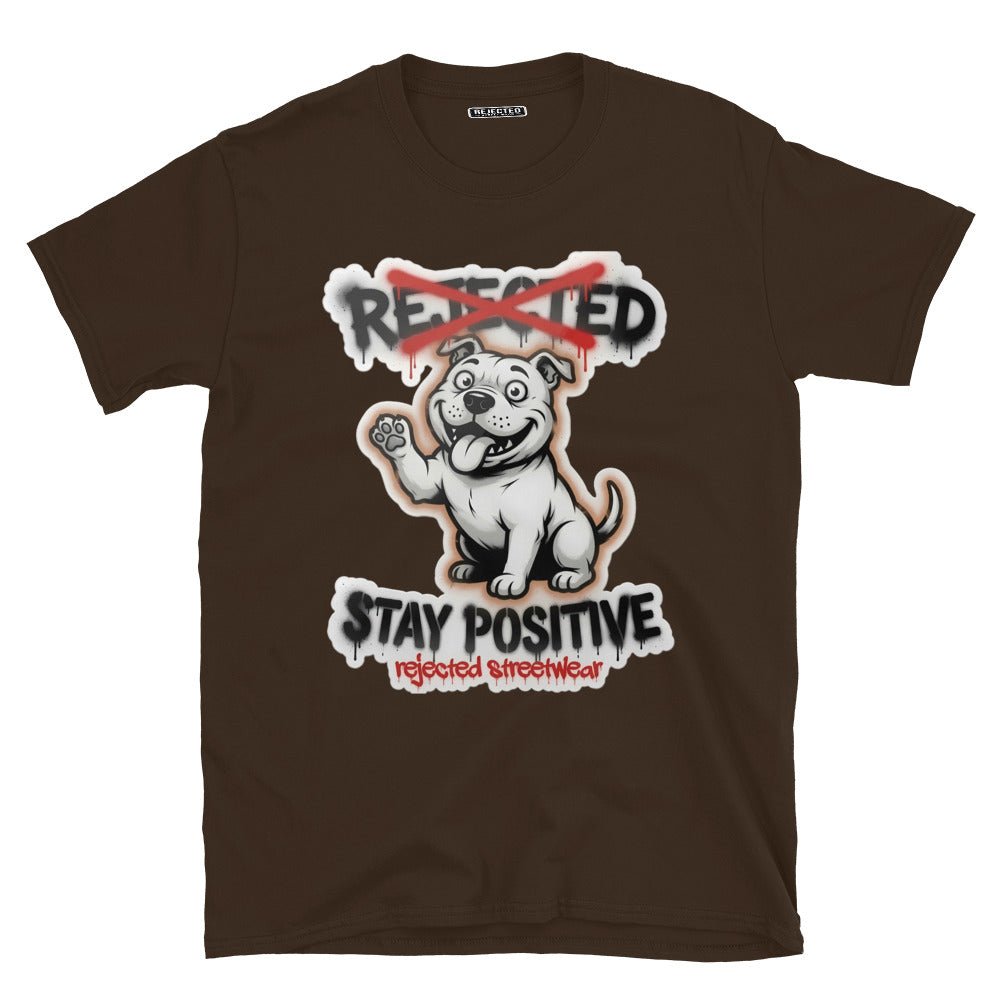 Stay Positive pit bull tee — white bully pup sitting with one paw raised, REJECTED crossed out in red