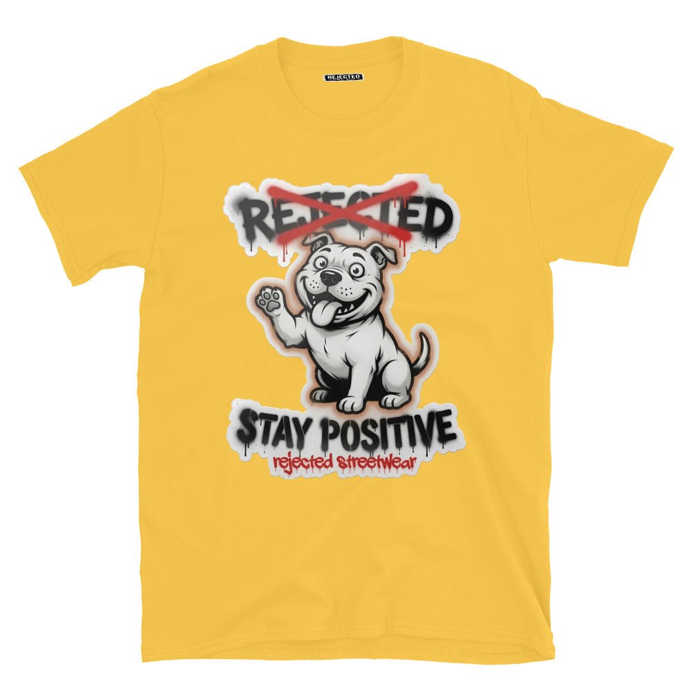 Stay Positive pit bull tee — white bully pup sitting with one paw raised, REJECTED crossed out in red