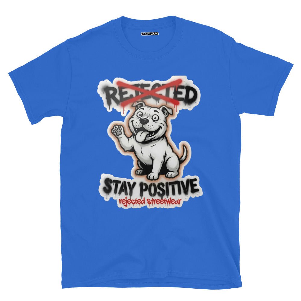 Stay Positive pit bull tee — white bully pup sitting with one paw raised, REJECTED crossed out in red