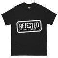 Rejected Street Wear plate logo tee — stamped black plate with a dashed border, corner x marks and REJECTED STREET WEAR inside