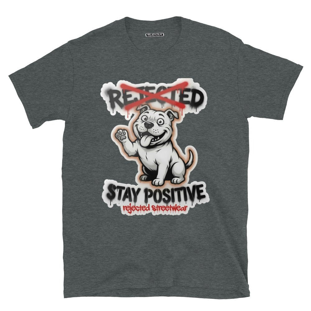 Stay Positive pit bull tee — white bully pup sitting with one paw raised, REJECTED crossed out in red