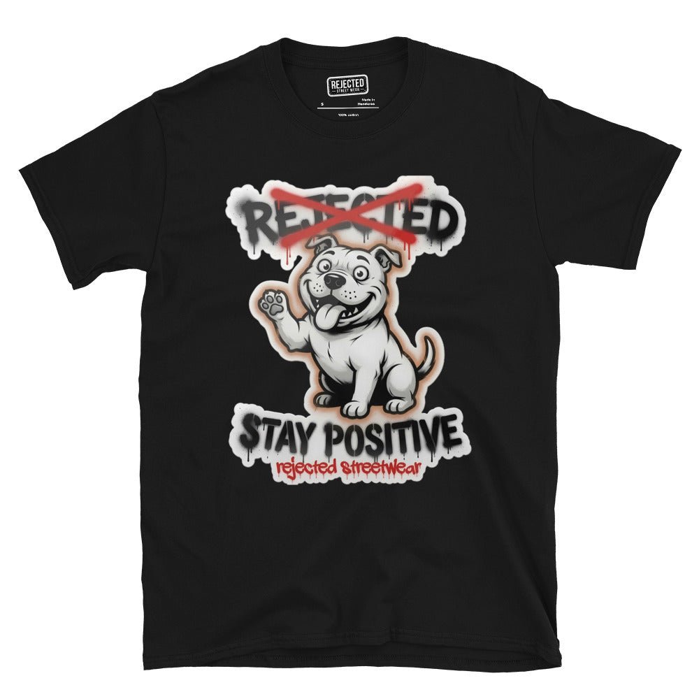 Stay Positive pit bull tee — white bully pup sitting with one paw raised, REJECTED crossed out in red