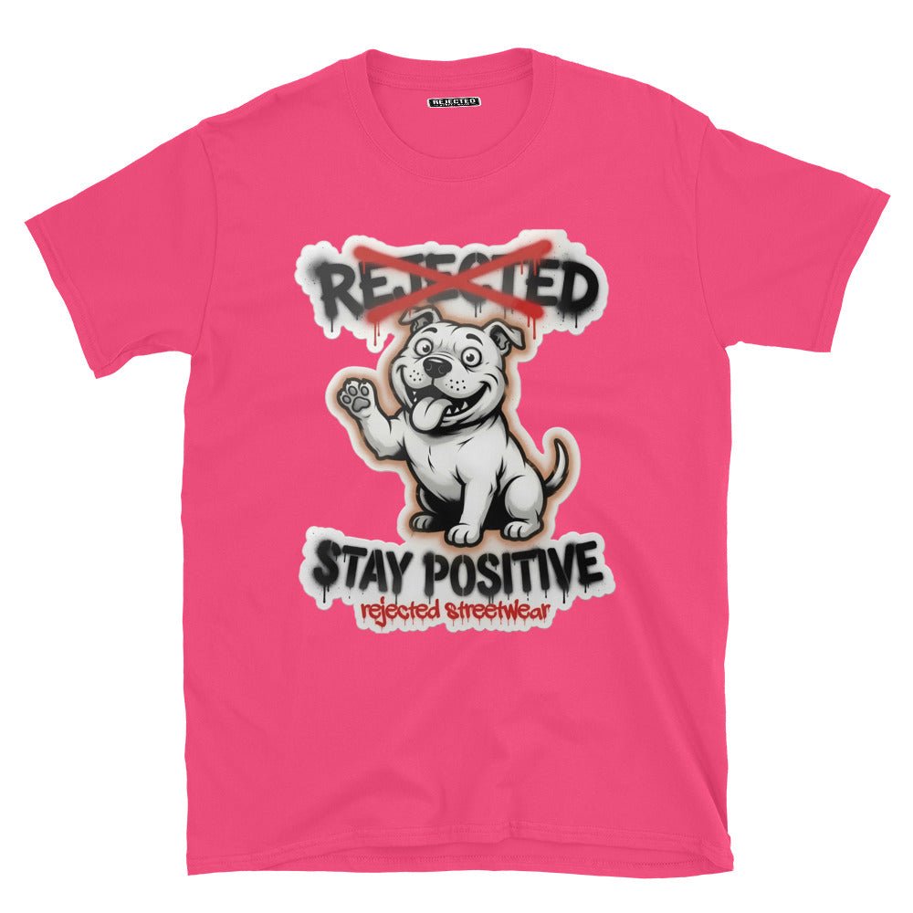 Stay Positive pit bull tee — white bully pup sitting with one paw raised, REJECTED crossed out in red