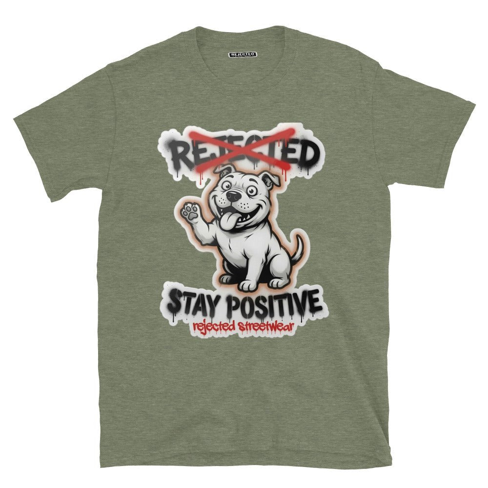 Stay Positive pit bull tee — white bully pup sitting with one paw raised, REJECTED crossed out in red